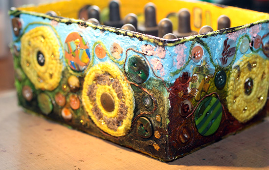 A decorated box using mixed media, a closeup