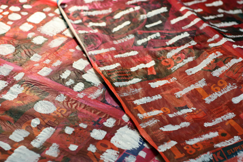 Wrapping paper from newspapers, process photo, adding gesso to create patterns