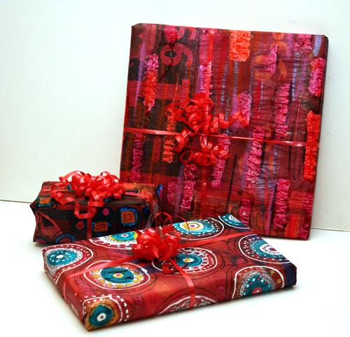 Wrapping paper from newspapers, three gifts wrapped in homemade gift paper