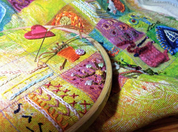 Stitching an embroidered sampler, by Peony and Parakeet