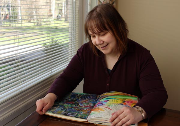 Paivi Eerola from Peony and Parakeet browsing her art journal