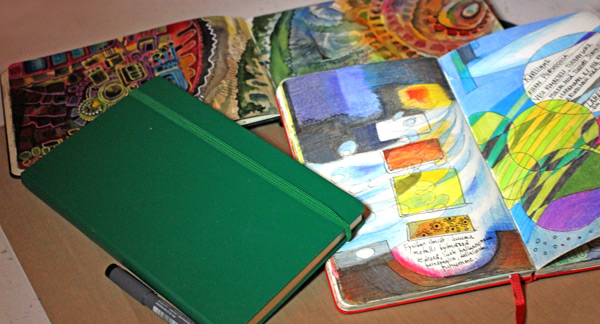 Moleskine art journals and a Moleskine notebook