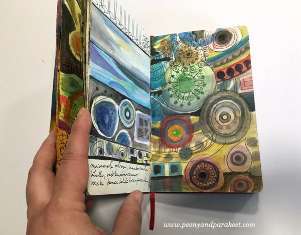 An art journal spread in a Moleskine Sketchbook. Browsing an art journal. By Peony and Parakeet.