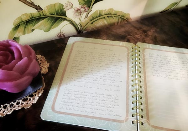 Writing a story in an journal, by Peony and Parakeet