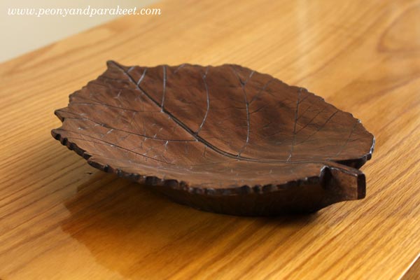 Hand-carved wooden leaf.