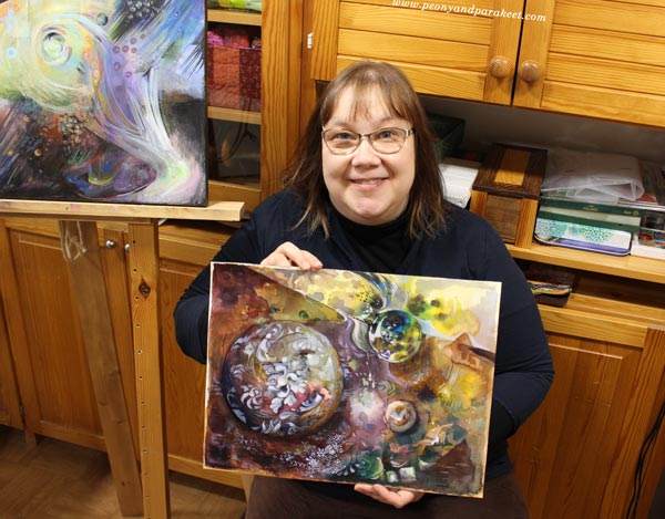 Paivi Eerola and her paintings.