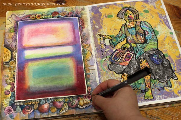Drawing a decorative frame on an art journal. By Paivi Eerola of Peony and Parakeet.