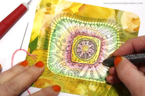 Decorating a tin box with beads, embroidery floss, and hand-drawn and hand-painted papers. By Paivi Eerola of Peony and Parakeet.