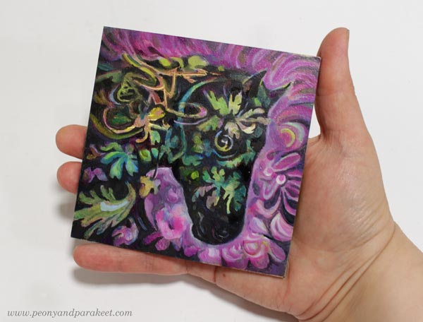 Holding a miniature horse painting, made by Paivi Eerola of Peony and Parakeet.