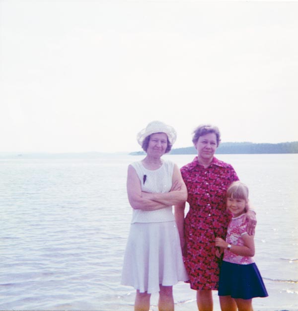 Three women in the Nurmes harbor, Finland.
