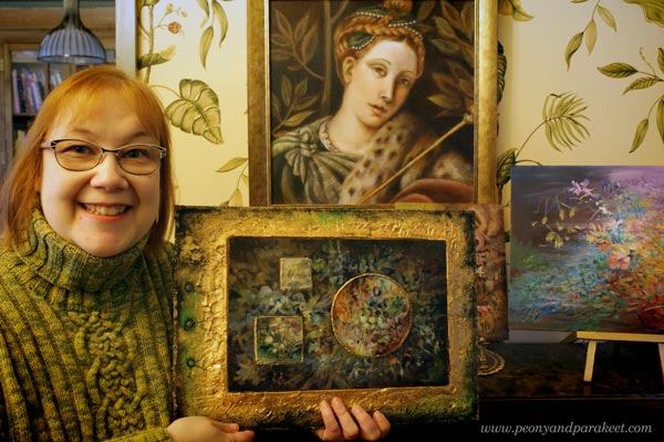 Paivi Eerola and her paintings.