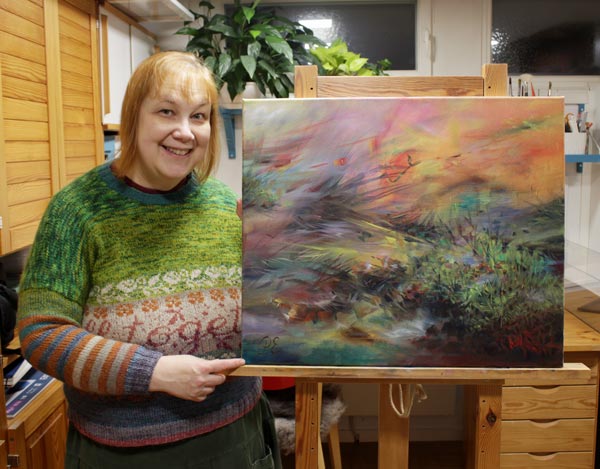 A Finnish artist Paivi Eerola and her painting.