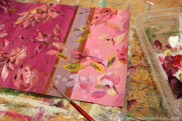 Adding details to a monoprint with a brush. By Paivi Eerola of Peony and Parakeet.