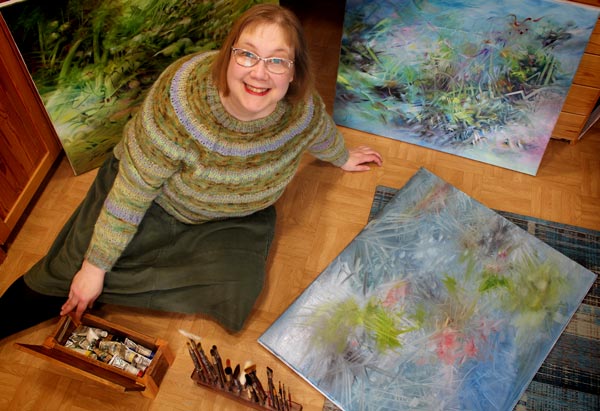 Paivi Eerola surrounded by her art. Read her story about becoming an artist!