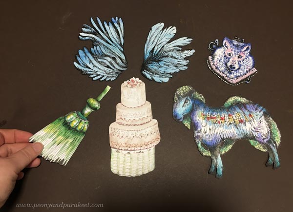 Arranging handdrawn and handpainted collage pieces
