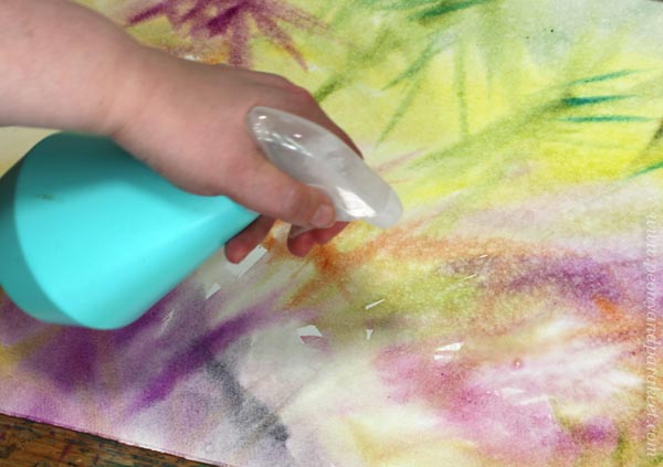 Spraying on watercolor paper. Getting colors mixed naturally.