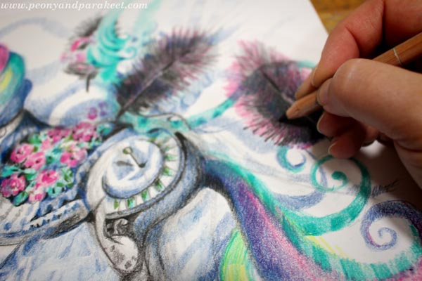 Coloring details with colored pencils.
