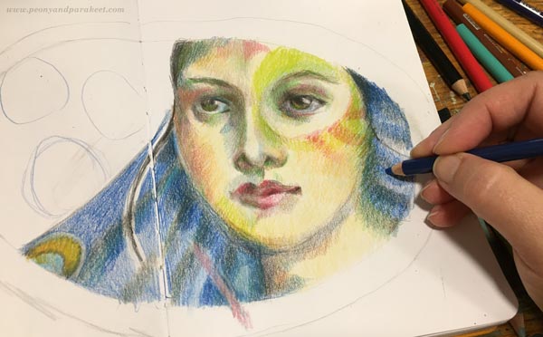 Making of a colored pencil diary. Drawing a face with colored pencils.