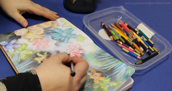 Drawing joyful flowers with colored pencils.