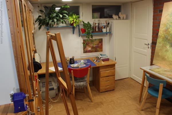 Artist studio by Paivi Eerola of Peony and Parakeet. Colored pencil art and oil paintings.