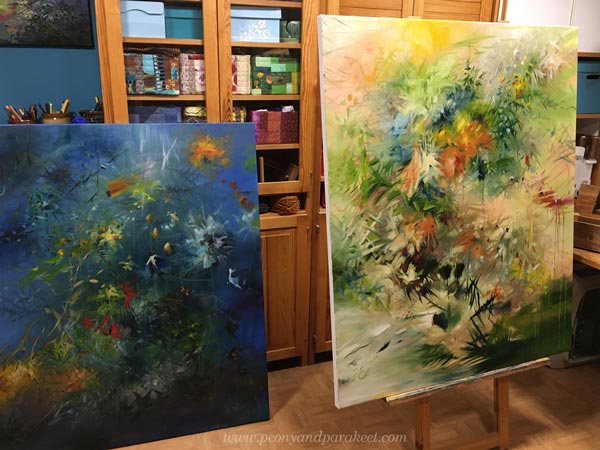 Oil paintings in a studio marking an artistic development.