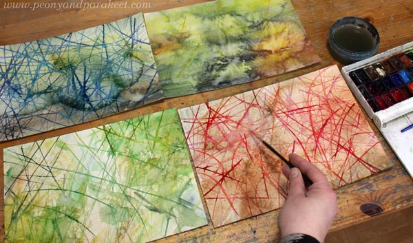 Painting lines that are like hays on watercolor backgrounds.