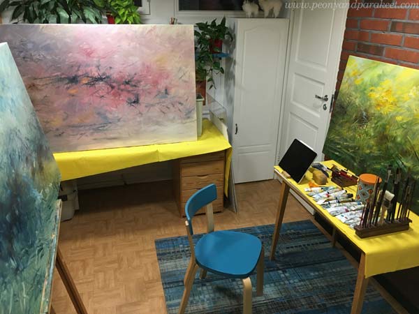 Paivi Eerola's small studio filled with paintings in progress.