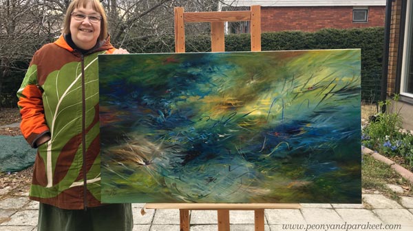 A Finnish aritst Paivi Eerola and her oil painting.