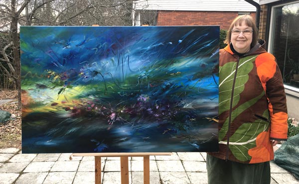Paivi Eerola and her oil painting for her first solo show.