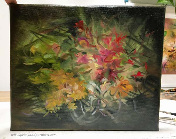 A small floral painting in progress.