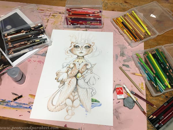 Drawing an animal character with colored pencils.