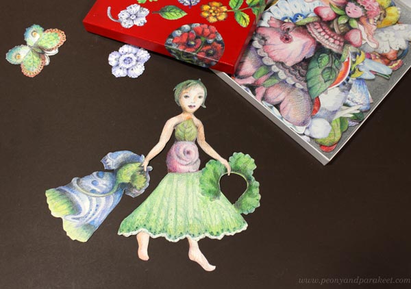 Drawing paper dolls and their clothing.
