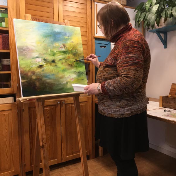 An artist Paivi Eerola from Finland painting in her studio. Read more about her artistic influences.