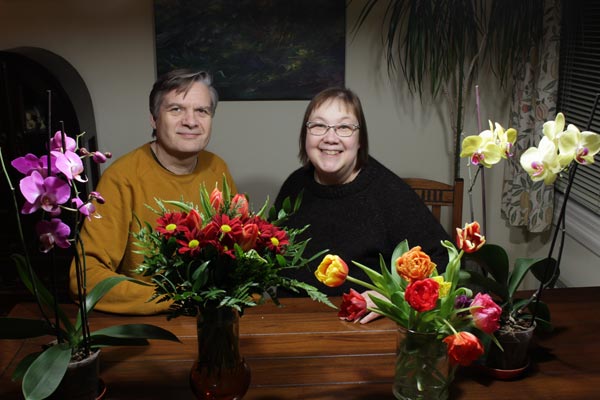 Paivi Eerola and her husband with flowers.