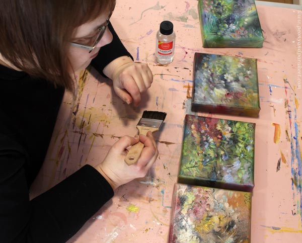 Varnishing small oil paintings with Gamvar.