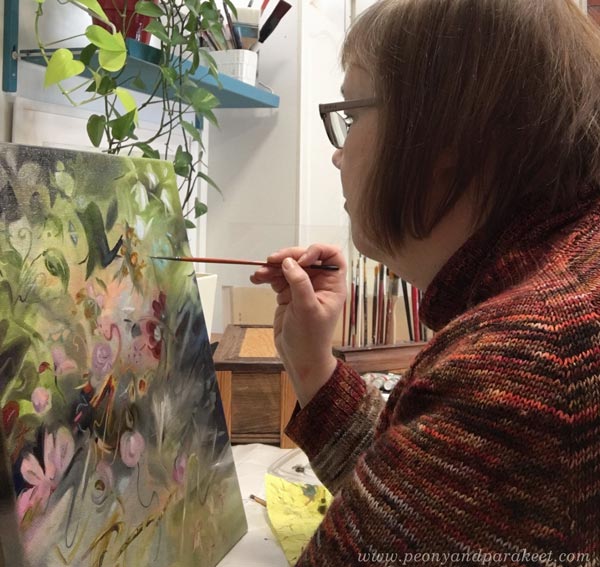 Creating wonderland art. Paivi Eerola painting a small piece inspired by Alice in Wonderland.