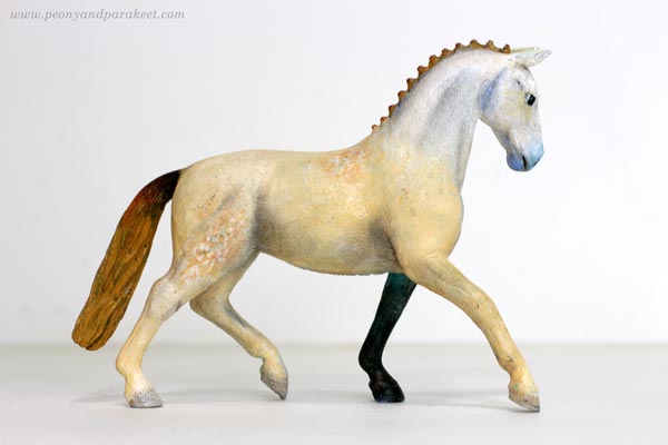A fantasy horse figurine, repainted Schleich horse by Paivi Eerola.