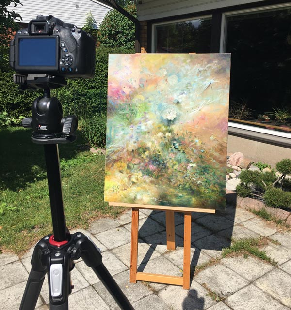 Photographing a finished oil painting.