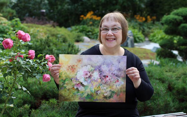 Päivi Eerola and her art, inspired by a garden. Watercolors and colored pencils on paper.