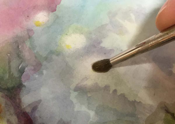 Watercolor painting techniques: adding soft spots by wiping the paint off.