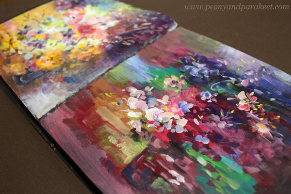 Art journal filled with flower paintings.