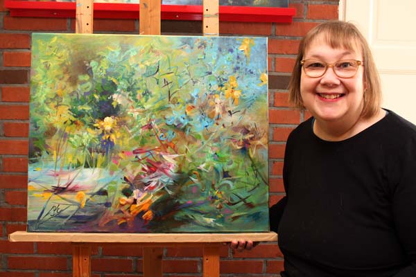 Paivi Eerola and her painting Muutosvoima - Driving Force.