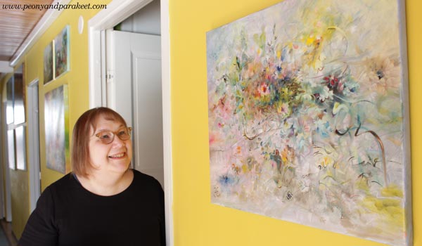 Paivi Eerola and her paintings.