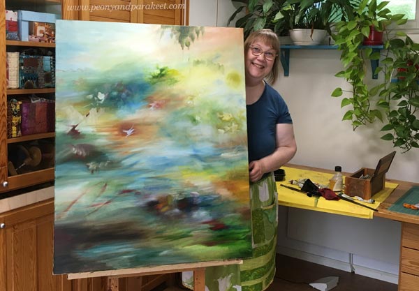 Paivi Eerola and her oil painting in progress.