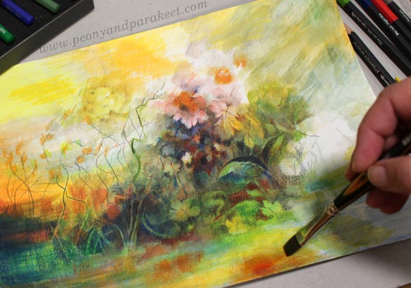 Using a brush with watercolor pencils.