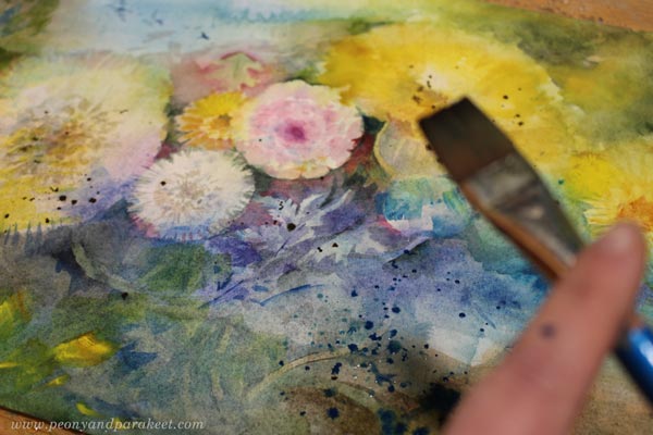 Adding random spots to a watercolor painting.