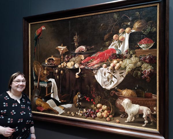 Visiting museums and galleries. Admiring Adriaen van Utrecht's still life painting at the Rijksmuseum, Amsterdam.