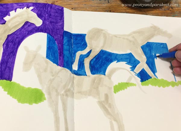 Starting a horse drawing with felt tip pens.