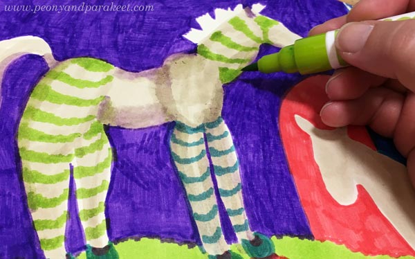 Adding simple decorations with felt tip pens.