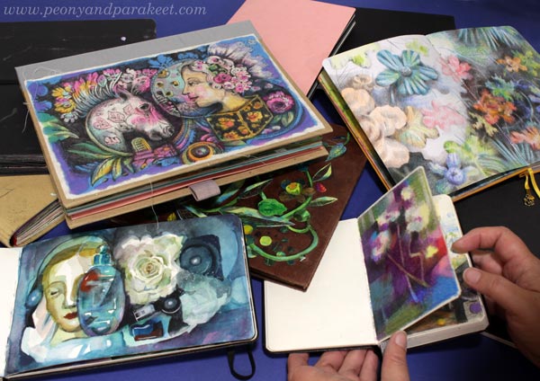 A pile of art journals of many kinds. Art journal inspiration for artists.